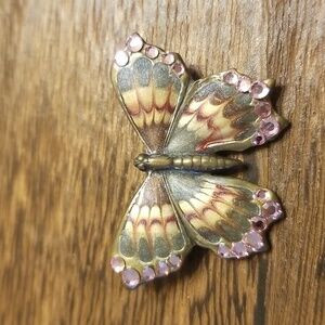Butterfly pin with pink sparkle on the wings